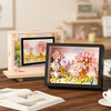 A framed display board showing a colorful 3D flower building blocks set for DIY craft kit.
