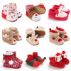 A collection of adorable animal-themed baby first walker shoes in various colors and patterns.
