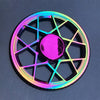 A rainbow metal fidget spinner with a hexagonal design and a central smooth rotating element.