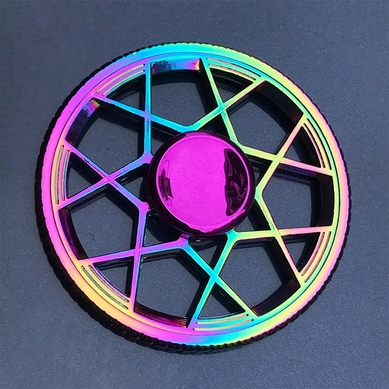 A rainbow metal fidget spinner with a hexagonal design and a central smooth rotating element.