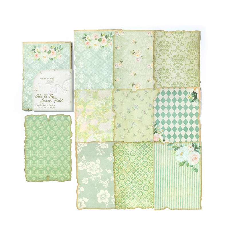 A collection of vintage, aged green and pink floral patterned paper sheets for journaling and scrapbooking.