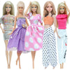 A set of four handmade casual doll outfits for 1/6 scale dolls featuring various pink, purple, and white floral dresses.