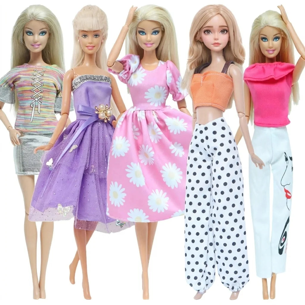 A set of four handmade casual doll outfits for 1/6 scale dolls featuring various pink, purple, and white floral dresses.
