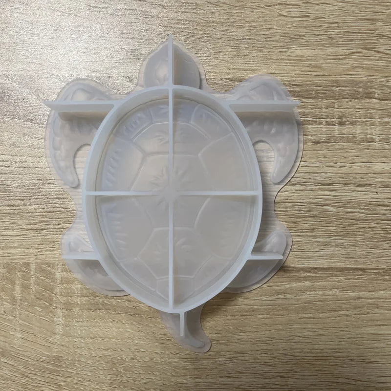 Clear silicone molds shaped like a gecko and a turtle for resin, soap, and candle making