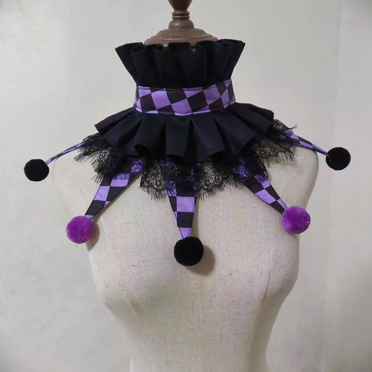 Handmade colorful clown ruff collar with black and purple checkered fabric and pom-pom accents