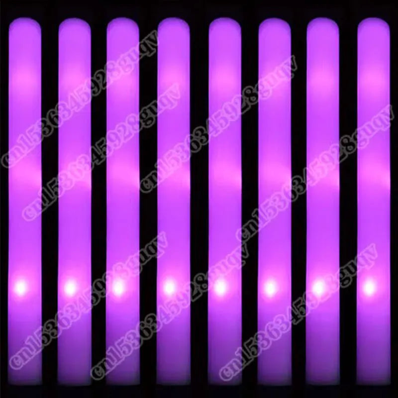 A row of purple LED glow sticks are displayed against a black background.