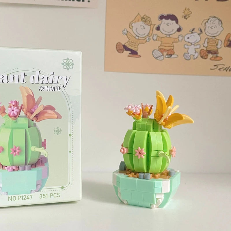 A miniature cactus flower bouquet building block set featuring green and pink elements.