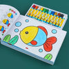 A colorful coloring book featuring a large yellow fish illustration and a box of colored pencils.