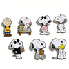 A set of seven enamel pins featuring Snoopy characters in various poses and scenes.