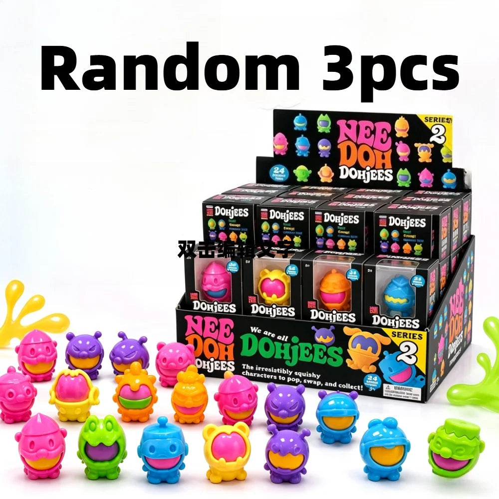 A collection of random Needoh DohJees squishy fidget toys in various colors and shapes.