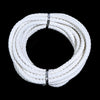 A coil of white round braided leather cord for jewelry making and DIY crafts.