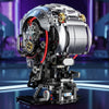 A detailed mechanical skeleton head building kit with silver and black components and red LED lights.