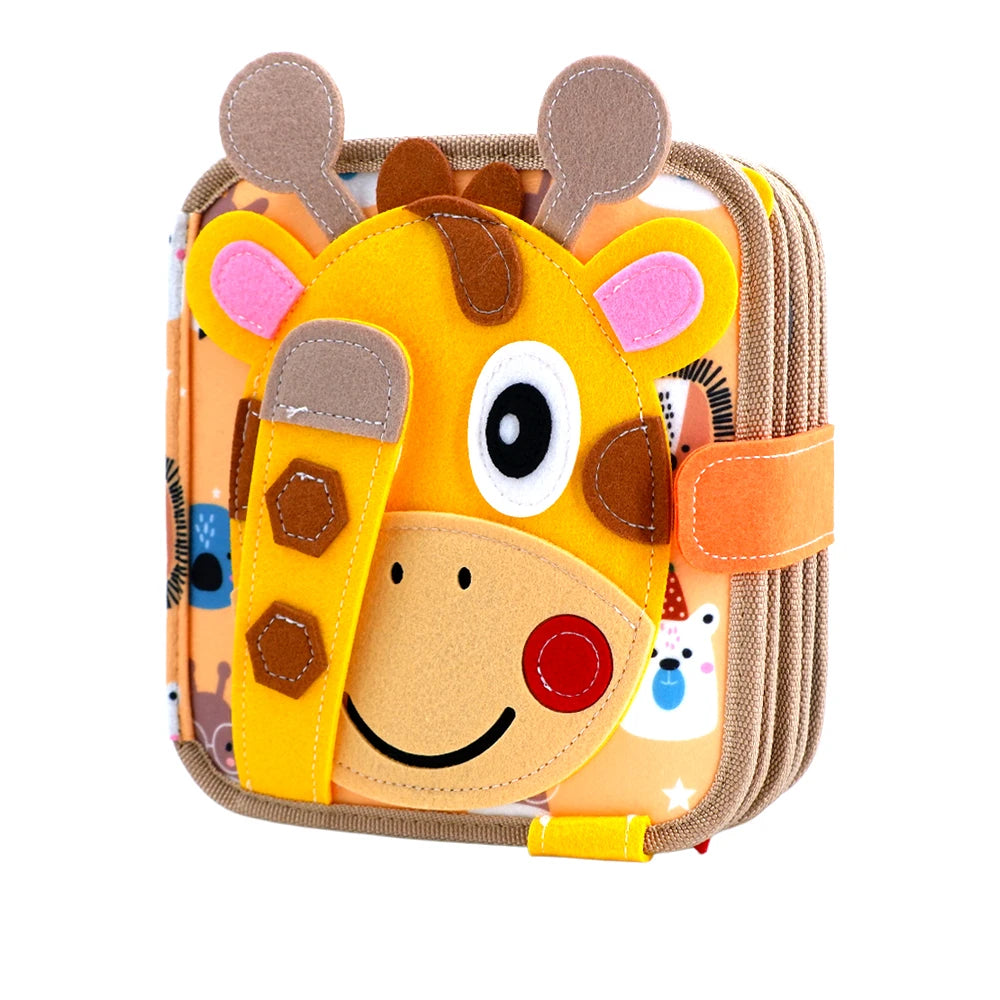 A felt busy board featuring a giraffe face with large eyes and orange ears, designed for toddler educational activities.