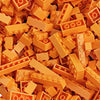 A pile of colorful plastic building blocks in various shapes and sizes.