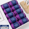 A box of YEDAN MERINO worsted wool thread yarn in purple and blue colors for knitting projects