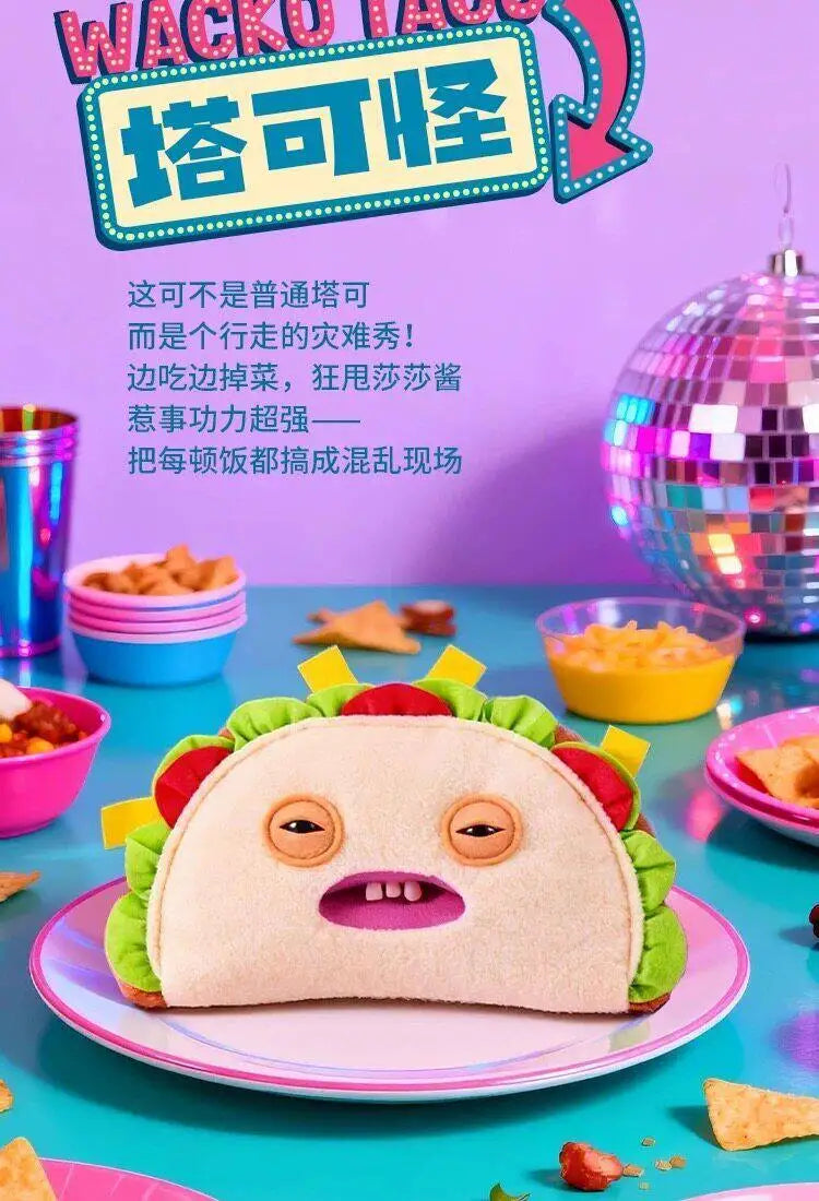 A cute monster plush toy with large eyes and pink accents is displayed on a plate.