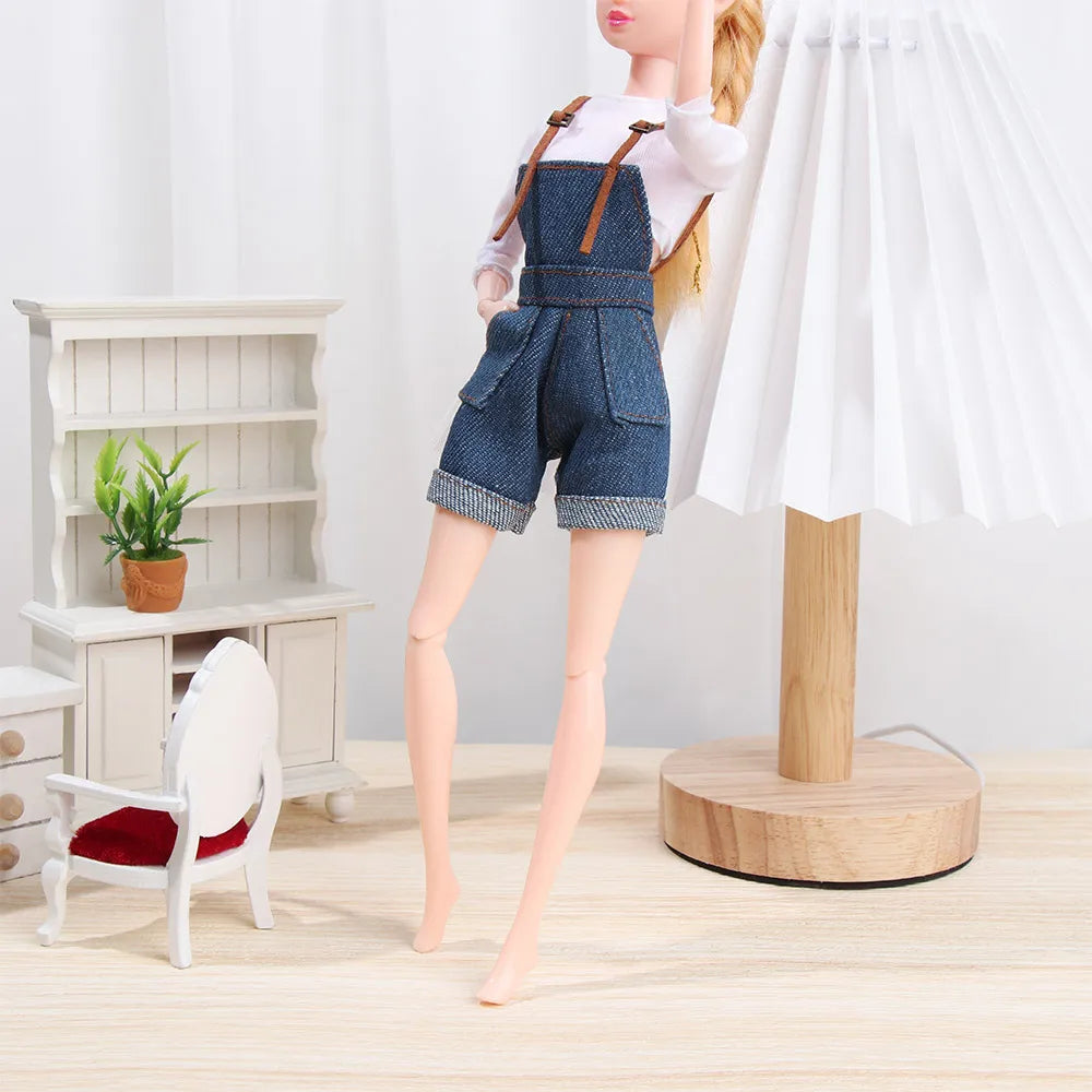 A mini doll wearing denim overalls and a white t-shirt standing next to a modern lamp.
