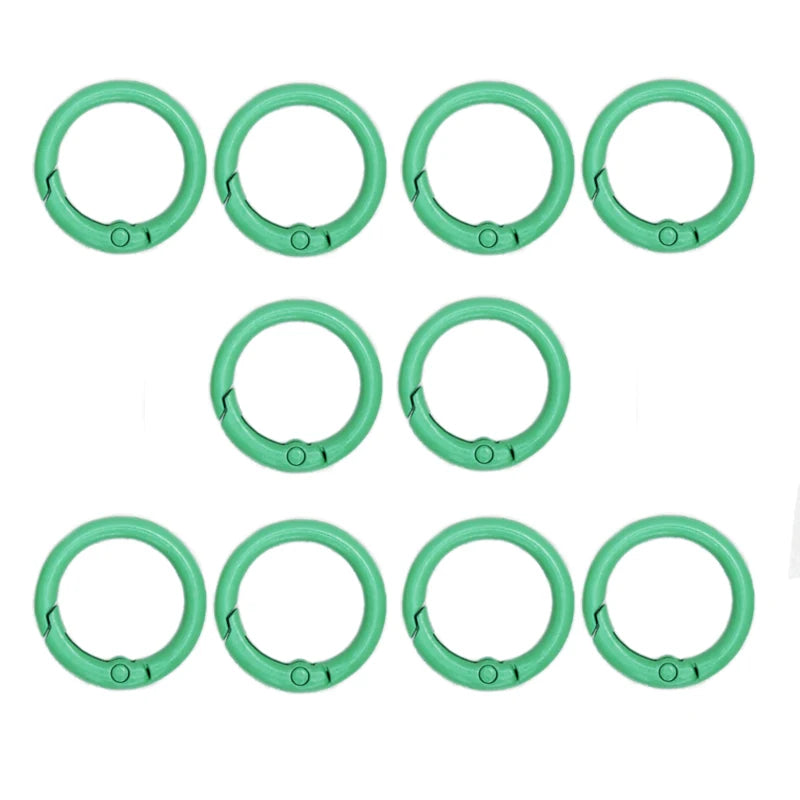 A set of ten bright green alloy snap hook keychain clips arranged in two rows.