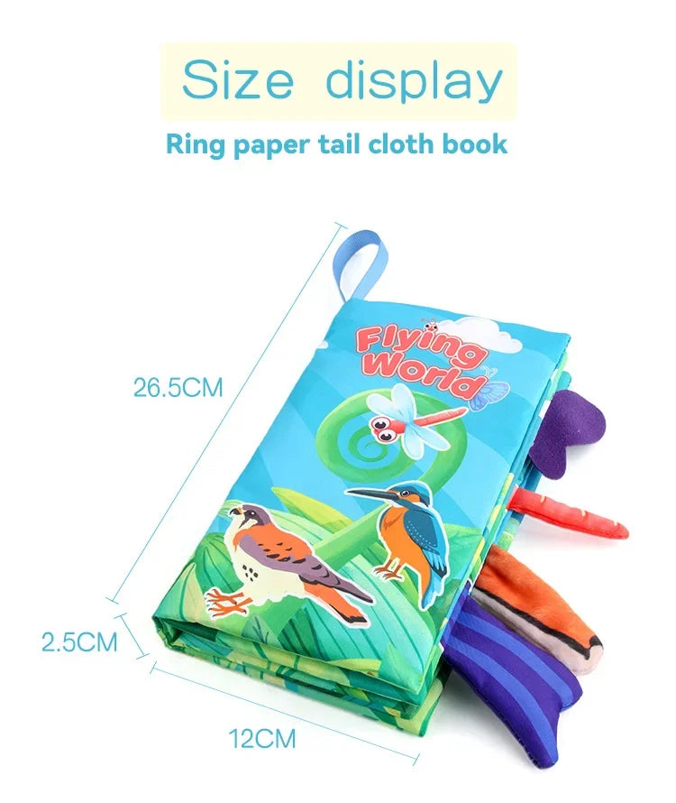 A display of a Ring paper tail cloth book showing its size, featuring colorful illustrations and crinkle sounds.