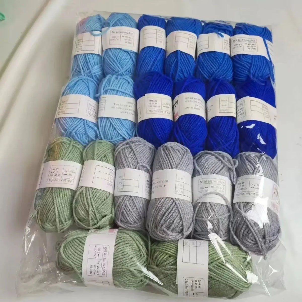 A pack of 20 skeins of milk cotton blend yarn in various colors for knitting and crochet projects.