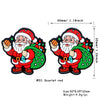A silicone bead depicting Santa Claus with a red suit and white beard, featuring festive Christmas colors.
