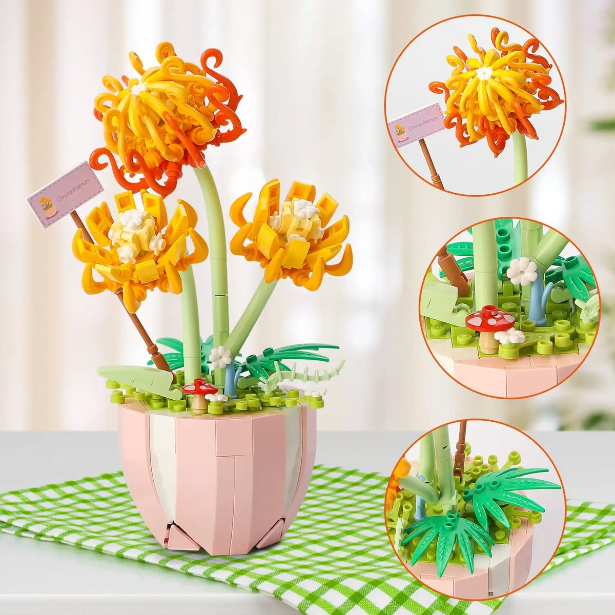 A floral bouquet building block set featuring orange and yellow flowers displayed in a pink pot on a green checkered mat.