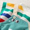 A close-up of a kids striped dinosaur two-piece outfit set featuring white, yellow, green, and blue stripes.