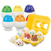 A set of colorful matching eggs used as a learning toy for toddlers, including green, yellow, and purple eggs.
