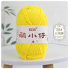 A ball of bright yellow chenille yarn labeled with Chinese characters for knitting and crochet.