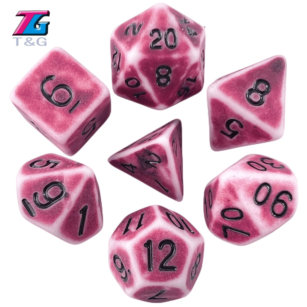 A set of pink and purple retro polyhedral dice showing various numbers like 5, 6, 8, 10, and 12.
