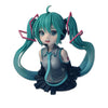 PVC figure of Hatsune Miku with teal hair and headphones, featuring a stylized anime design.