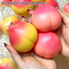 Hands holding a pink and yellow squishy peach stress ball