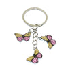 Silver hoop keychain with two pink and yellow butterfly charms