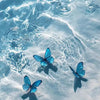 Blue butterfly paint by numbers kit on canvas floating in clear water