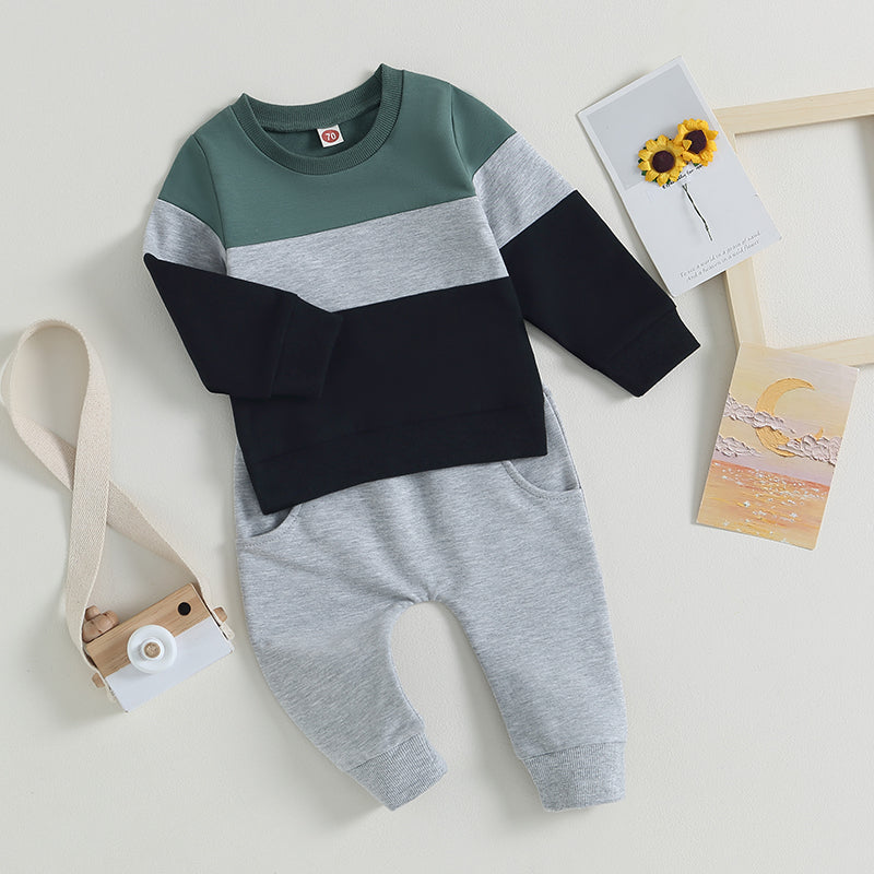 Toddler boys color block sweatshirt and pants set in gray, black, and sage green.