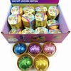 A box of glitter unicorn dumpling squishies in various colors and a set of gold glitter balls.