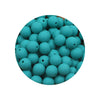 A circular arrangement of small, teal silicone beads for DIY jewelry making.