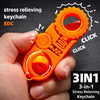 An orange 3-in-1 stress relieving keychain featuring a fidget mechanism and a spinning component being held by a hand.