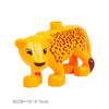 A yellow plastic lion building block toy with an orange and black leopard print on its body.