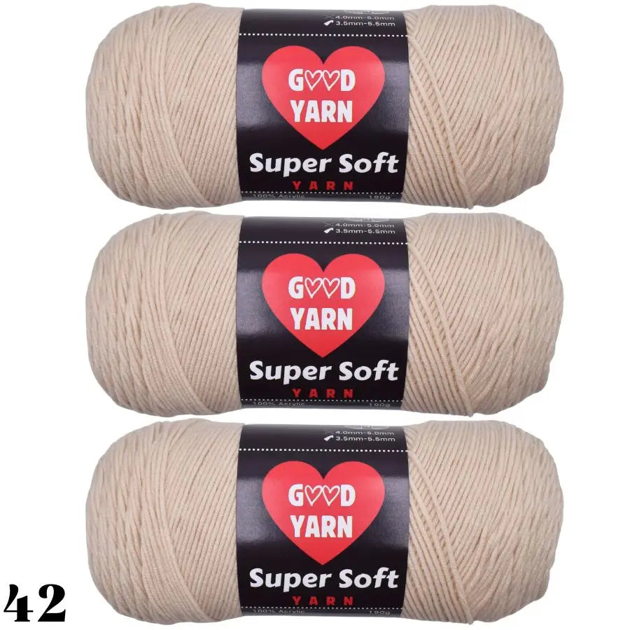 Three skeins of Super Soft Yarn in a natural beige color are shown for crochet and knitting projects.