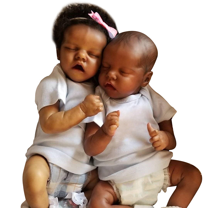A realistic newborn twin baby doll of African American descent, handcrafted and 43 cm tall.
