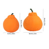 An orange stress ball shaped like a small pumpkin, used for anxiety relief.