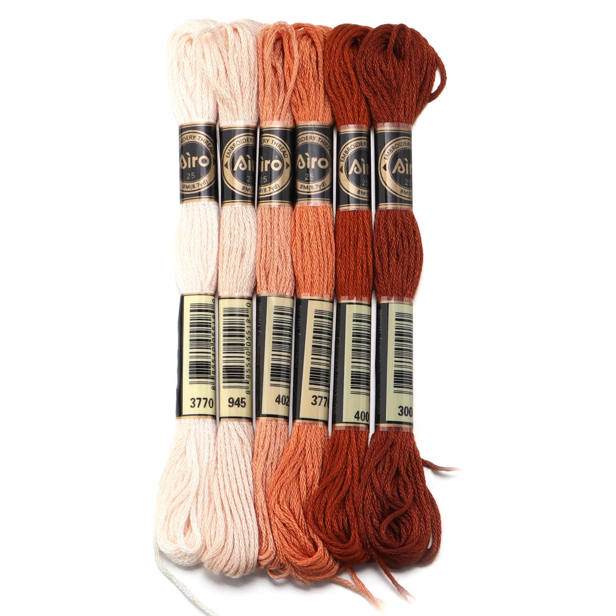 A set of six skeins of vibrant embroidery thread in various shades of orange and pink for cross stitch and DIY crafts