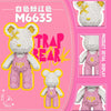 A pink and yellow micro building block set featuring a cute bear figure.
