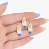 Gold-toned enamel charms shaped like tropical leaves and waves for jewelry making