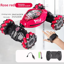 A close-up of a remote control watch and glove accessory for a 4WD RC stunt car.