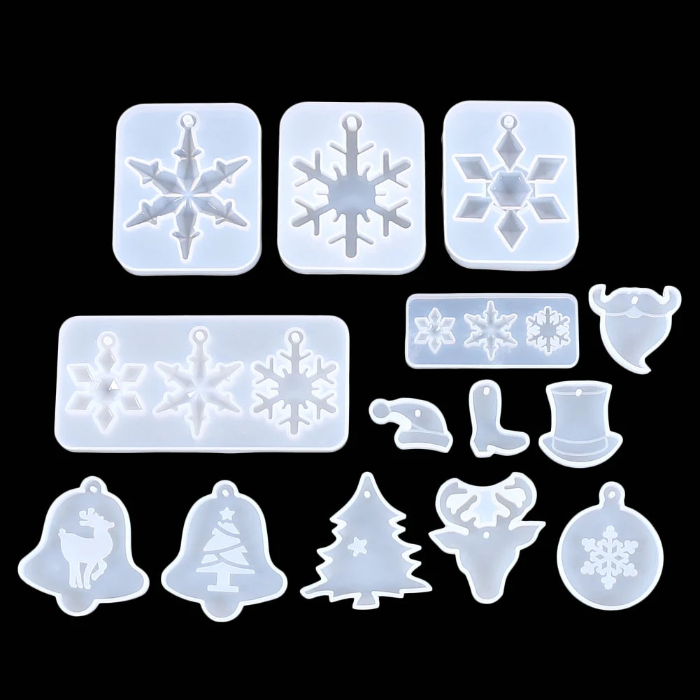 A collection of clear silicone molds featuring various snowflake and Christmas tree shapes for jewelry and craft projects.