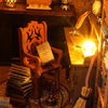 A wooden chair and books are displayed in a dark setting, part of a DIY book nook kit.