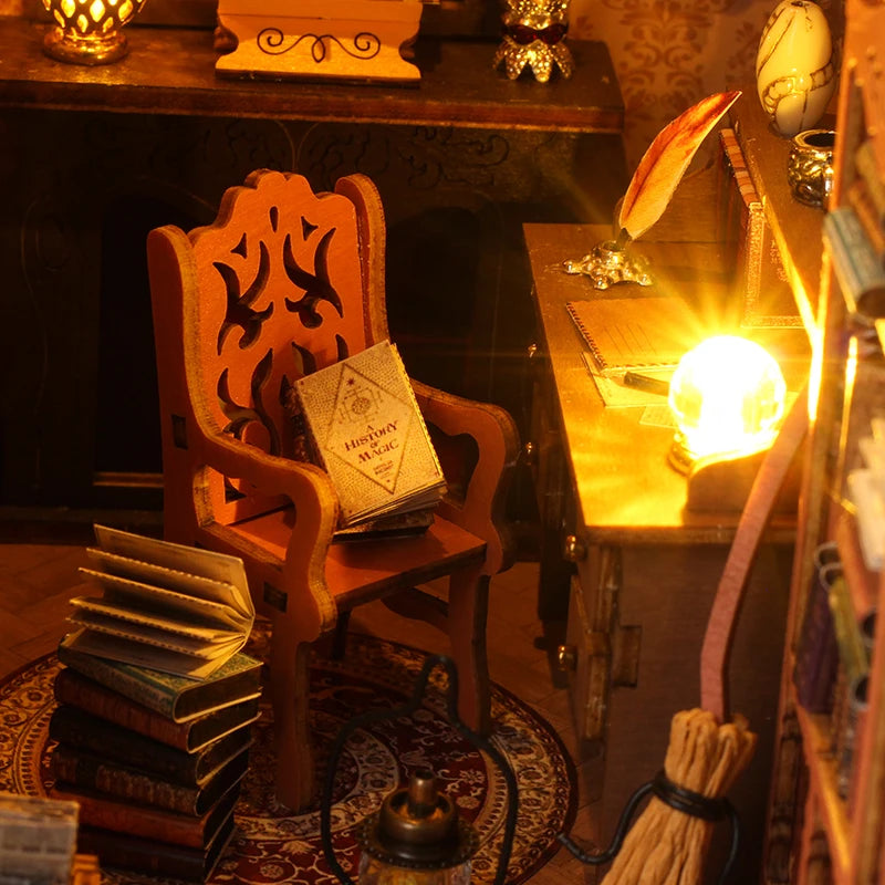 A wooden chair and books are displayed in a dark setting, part of a DIY book nook kit.