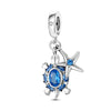 Sterling silver ocean life charm pendant set featuring a starfish, sea turtle, and whale shark.